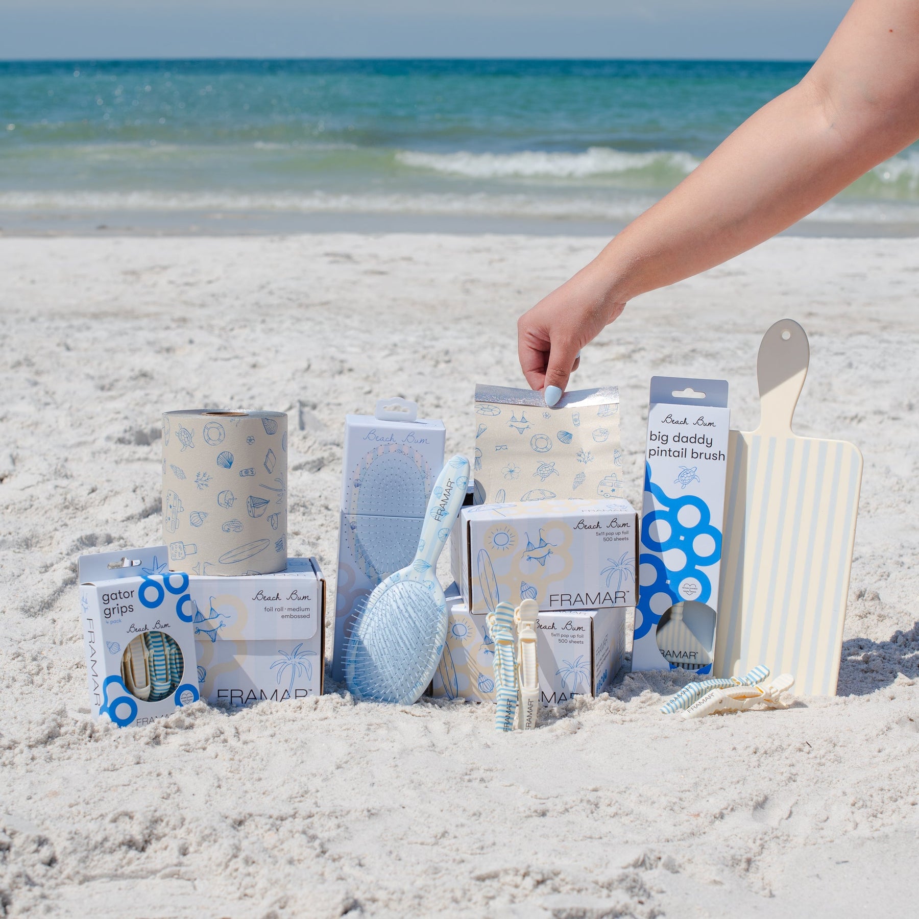 Beach Bum Collection on a striped beach towel