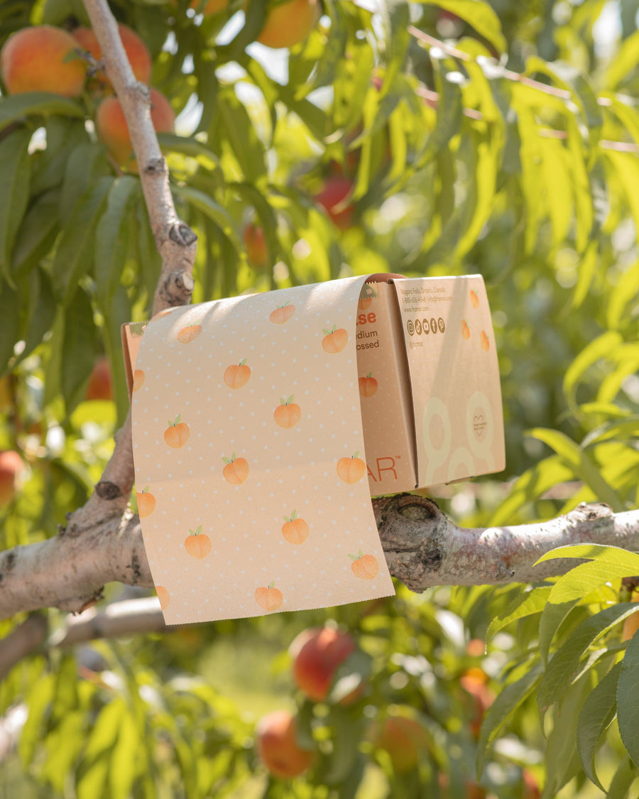 Peach patterned embossed foil roll in its dispensing box