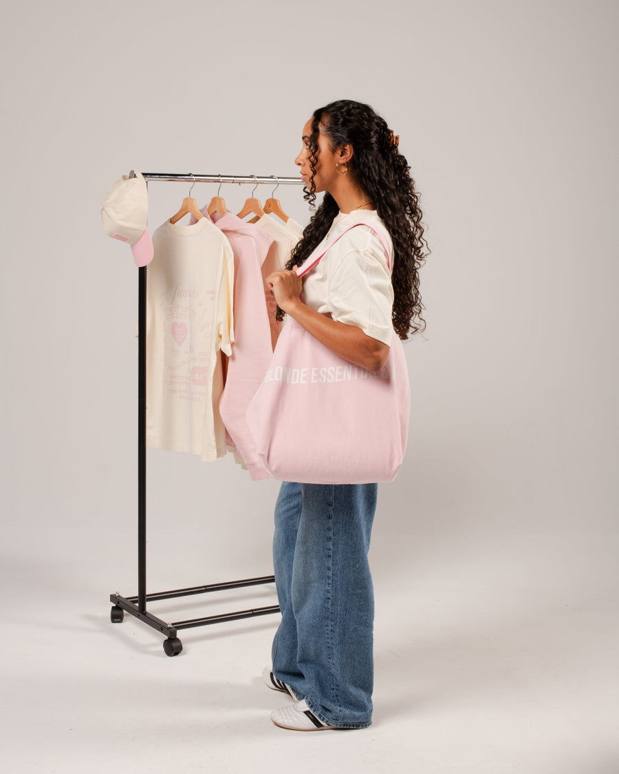 Pink and cream Framar merch styled with salon essentials